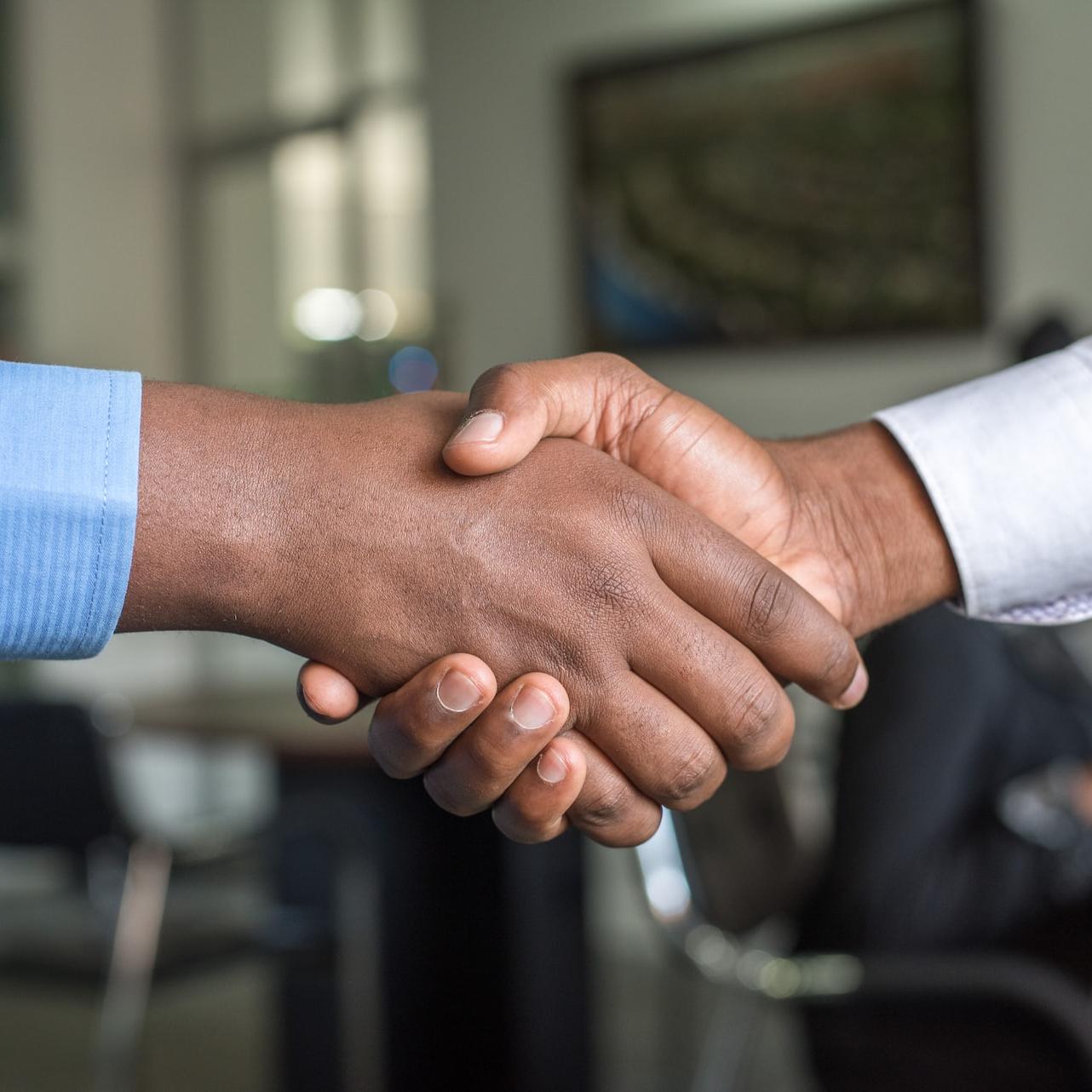 two people shaking hands